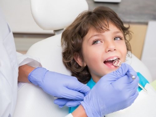 Child receiving dental exam