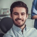 Man smiling during consultation with lip and tongue tie specialist