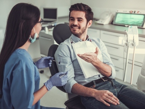 Specialty dentist and patient talking during consultation