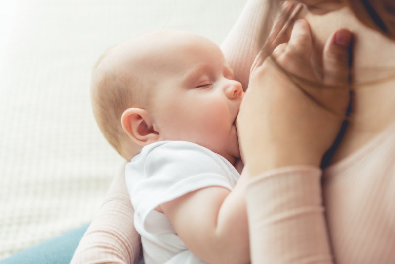 woman nursing her baby