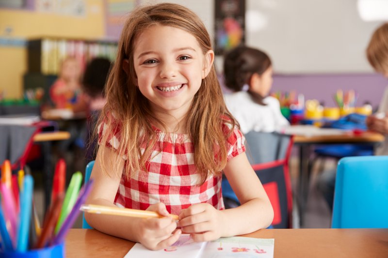 little girl at school smiling